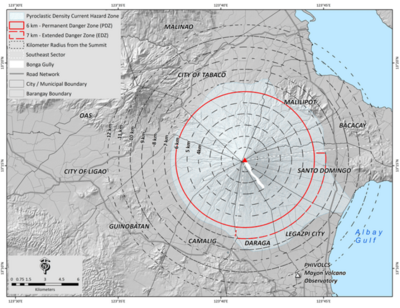 Topographic map of the Mount Mayon volcano in Albay, Philippines. The map is overlaid with concentric circles denoting kilometers from the crater. The volcano's Permanent Danger Zone lies at 6 kilometers and the Extended Danger Zone lies at 7 kilometers. The southeast quadrant of the volcano is considered a High-Risk Zone following an eruption in 1984. Image was originally published by researchers at the Philippine Institute of Volcanology and Seismology and the University of the Philippines - Open University in their paper titled "Moving for safety: a qualitative analysis of affected communities’ evacuation response during the 2014 Mayon Volcano eruption."
